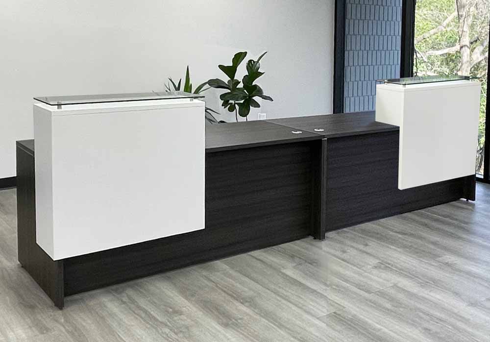 What are the dimensions of the storage pockets under the reception counter?